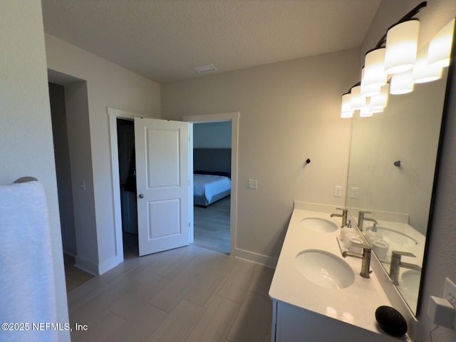 10065 Element Rd, Jacksonville, FL 32256 - ensuite bathroom with double vanity and baseboards