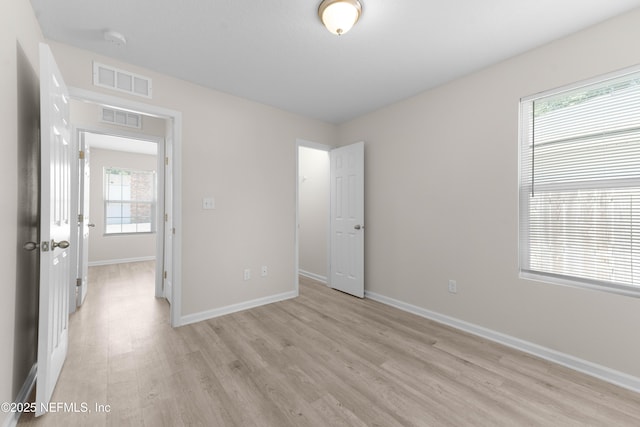 7529 Hare Ave, Jacksonville, FL 32211 - unfurnished bedroom with light wood-type flooring and baseboards