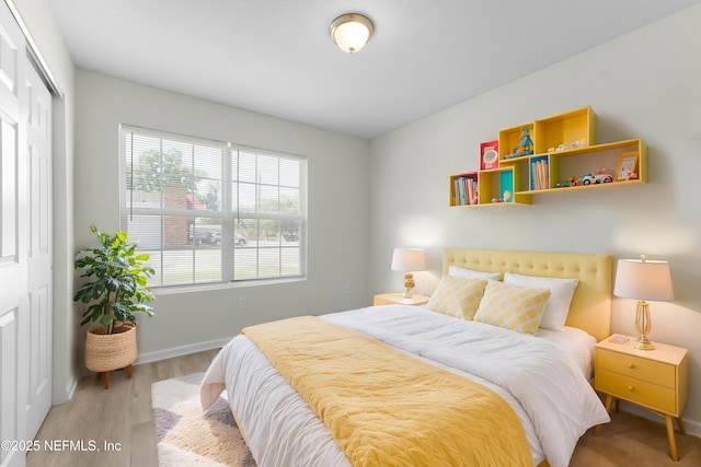 7529 Hare Ave, Jacksonville, FL 32211 - bedroom featuring wood finished floors, multiple windows, a closet, and baseboards
