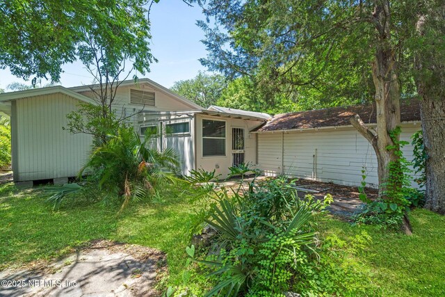 655 Linwood Ave, Jacksonville, FL 32206 - back of house featuring a sunroom