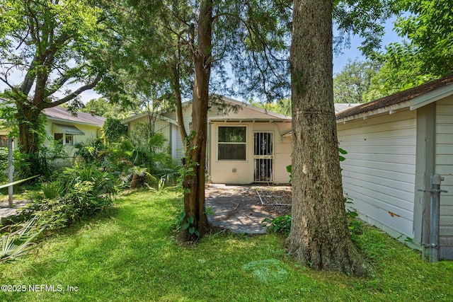 655 Linwood Ave, Jacksonville, FL 32206 - back of house featuring a yard and a patio