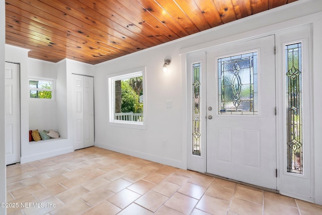 655 Linwood Ave, Jacksonville, FL 32206 - entrance foyer with plenty of natural light, light tile patterned floors, wood ceiling, and baseboards