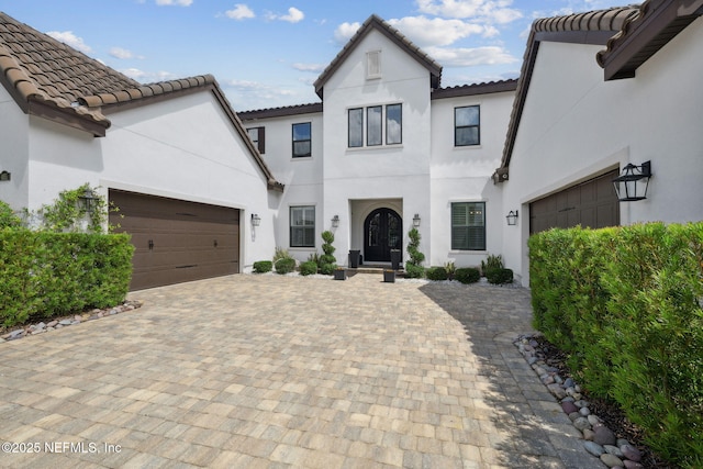 465 Deer Valley Dr, Ponte Vedra, FL 32081 - view of front facade featuring a tile roof, stucco siding, a garage, and decorative driveway