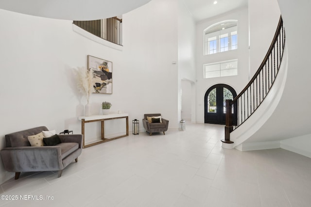 465 Deer Valley Dr, Ponte Vedra, FL 32081 - foyer with stairway, a high ceiling, plenty of natural light, baseboards, and french doors