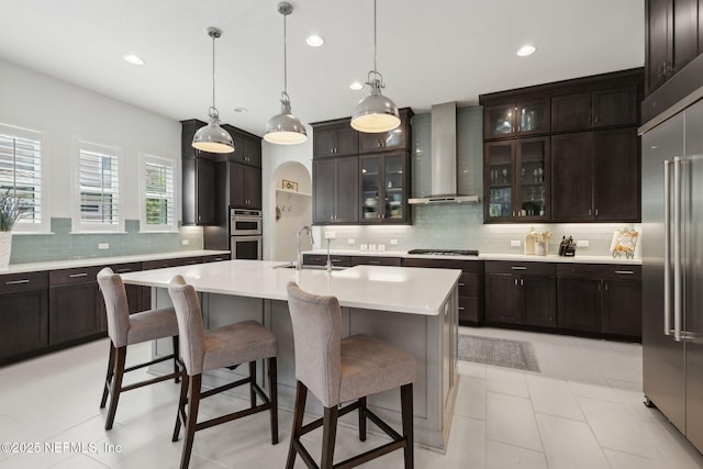 465 Deer Valley Dr, Ponte Vedra, FL 32081 - kitchen with wall chimney exhaust hood, a sink, backsplash, recessed lighting, and light countertops