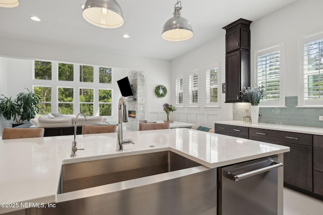 465 Deer Valley Dr, Ponte Vedra, FL 32081 - kitchen with a sink, open floor plan, stainless steel dishwasher, dark brown cabinetry, and recessed lighting
