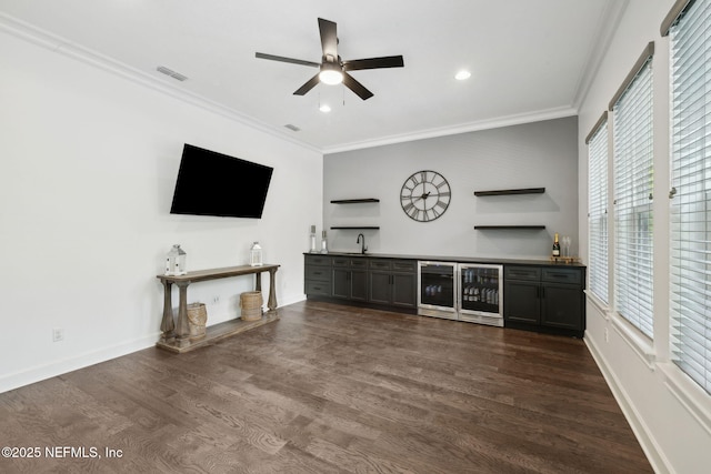 465 Deer Valley Dr, Ponte Vedra, FL 32081 - unfurnished living room featuring wet bar, wine cooler, ornamental molding, plenty of natural light, and recessed lighting