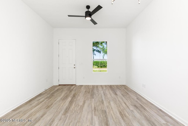 171 Cougar Rd, Jacksonville, FL 32220 - spare room featuring wood finished floors, a ceiling fan, and baseboards