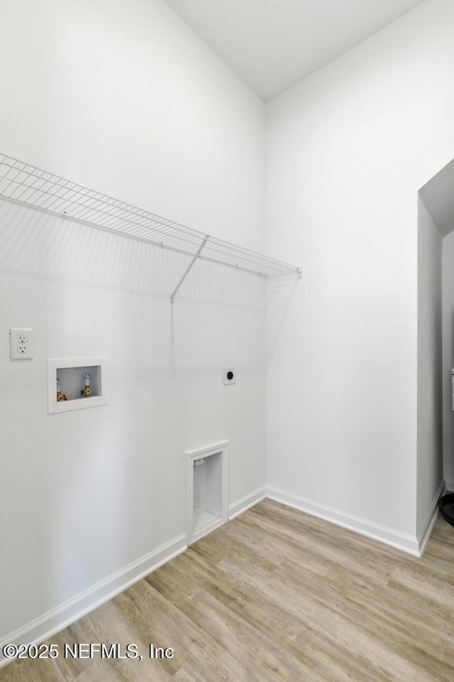171 Cougar Rd, Jacksonville, FL 32220 - washroom featuring washer hookup, wood finished floors, electric dryer hookup, and baseboards