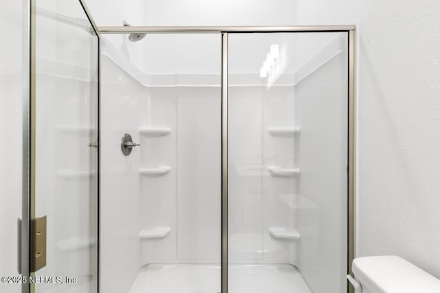 171 Cougar Rd, Jacksonville, FL 32220 - bathroom featuring a shower stall and toilet