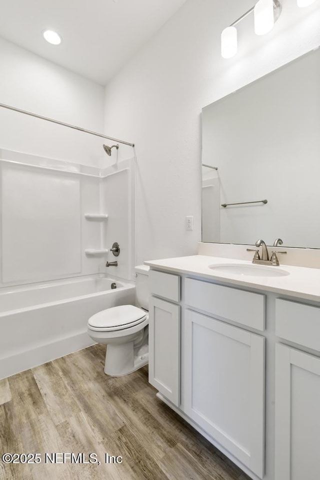 171 Cougar Rd, Jacksonville, FL 32220 - full bathroom featuring vanity, toilet, shower / tub combination, and wood finished floors