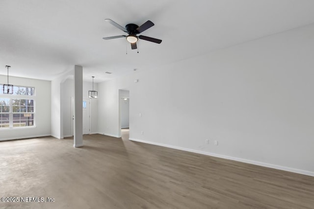 7830 Smart Ave, Jacksonville, FL 32219 - unfurnished living room with a ceiling fan and baseboards
