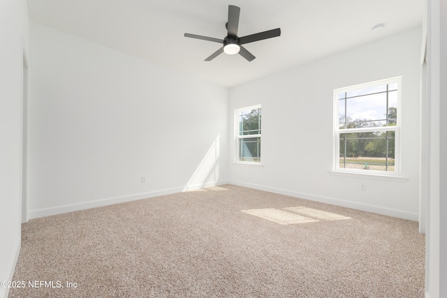 6249 Blue Marlin Dr, Keystone Heights, FL 32656 - spare room featuring carpet, baseboards, a ceiling fan, and a smoke detector