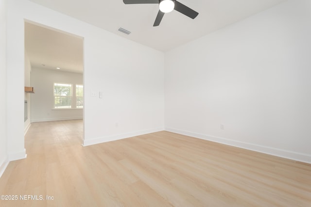 6249 Blue Marlin Dr, Keystone Heights, FL 32656 - unfurnished room featuring light wood finished floors, a ceiling fan, and baseboards