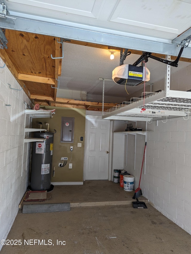 12301 Kernan Forest Blvd Unit 508, Jacksonville, FL 32225 - garage featuring water heater, electric panel, a garage door opener, and concrete block wall