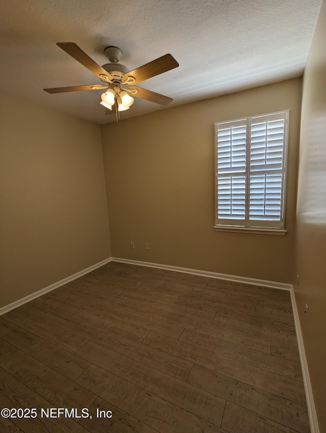 12301 Kernan Forest Blvd Unit 508, Jacksonville, FL 32225 - unfurnished room with dark wood finished floors, ceiling fan, and baseboards