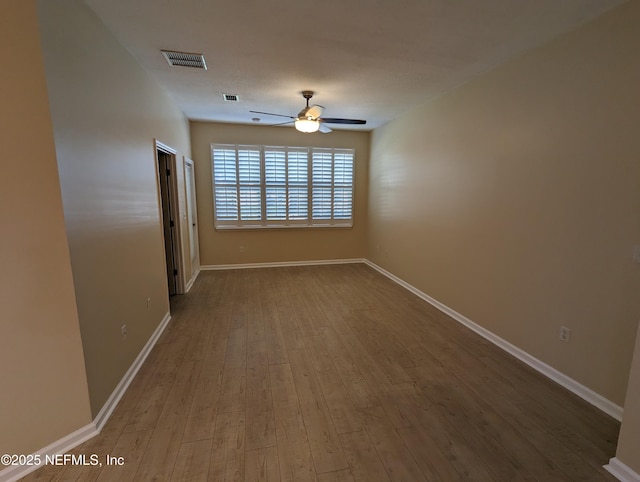 12301 Kernan Forest Blvd Unit 508, Jacksonville, FL 32225 - empty room featuring ceiling fan, dark wood finished floors, and baseboards