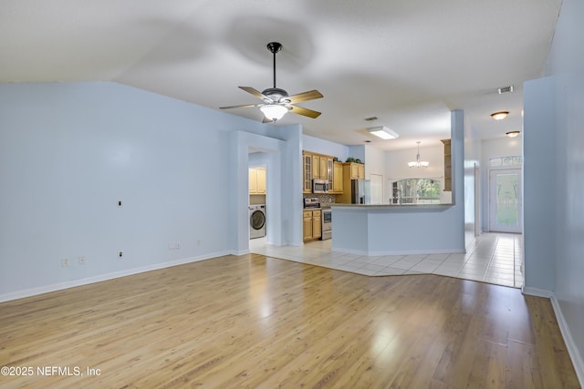 3784 Charles Green Rd, Hilliard, FL 32046 - unfurnished living room featuring washer / clothes dryer, a chandelier, light wood-style floors, ceiling fan, and baseboards