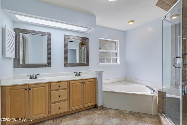 3784 Charles Green Rd, Hilliard, FL 32046 - full bath featuring a shower stall, a bath, double vanity, stone finish flooring, and a textured ceiling