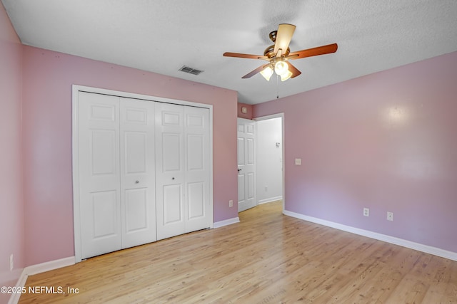 3784 Charles Green Rd, Hilliard, FL 32046 - unfurnished bedroom featuring baseboards, light wood-style floors, a closet, and ceiling fan