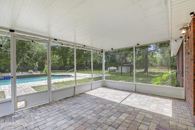 3784 Charles Green Rd, Hilliard, FL 32046 - unfurnished sunroom featuring view of scattered trees