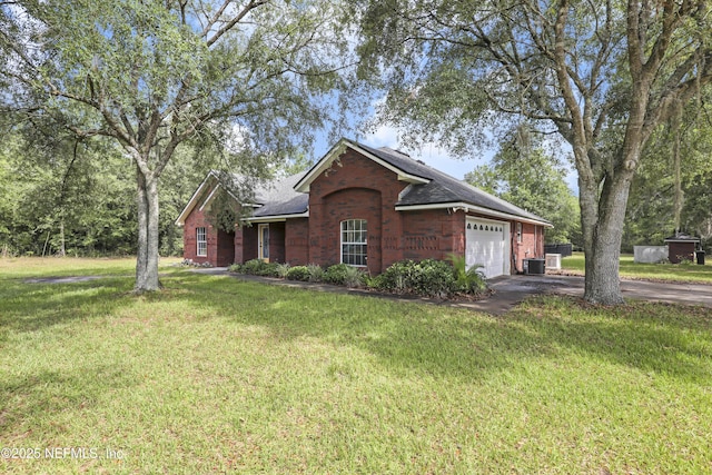 3784 Charles Green Rd, Hilliard, FL 32046 - ranch-style home featuring brick siding, asphalt driveway, an attached garage, roof with shingles, and a front yard