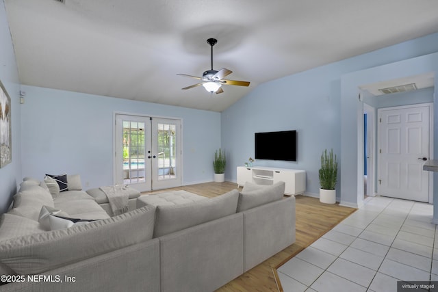 3784 Charles Green Rd, Hilliard, FL 32046 - living room with vaulted ceiling, french doors, a ceiling fan, light wood finished floors, and baseboards