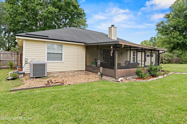 12422 Berry Patch Way, Jacksonville, FL 32225 - back of property with central AC, a sunroom, a chimney, and roof with shingles