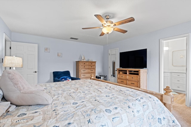 12422 Berry Patch Way, Jacksonville, FL 32225 - bedroom featuring a ceiling fan and ensuite bath