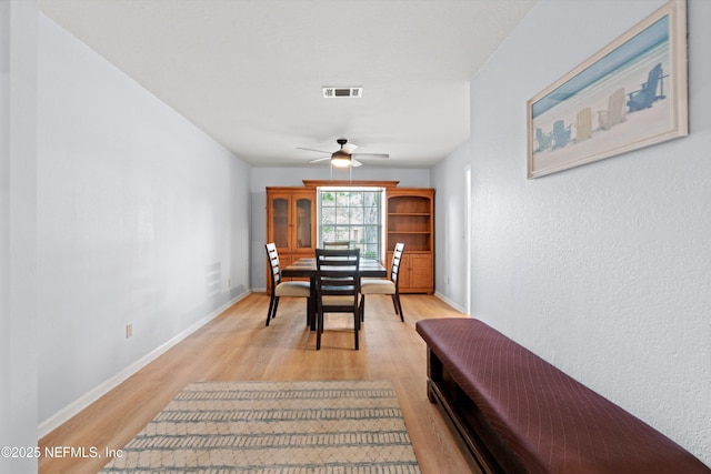 12422 Berry Patch Way, Jacksonville, FL 32225 - dining room with light wood-style floors, ceiling fan, and baseboards