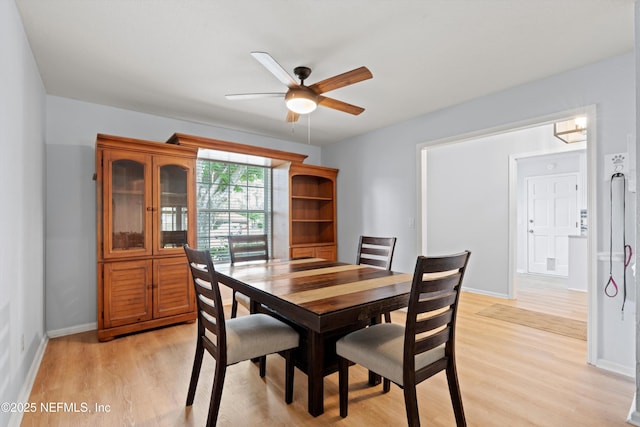 12422 Berry Patch Way, Jacksonville, FL 32225 - dining room with a ceiling fan, light wood-style flooring, and baseboards