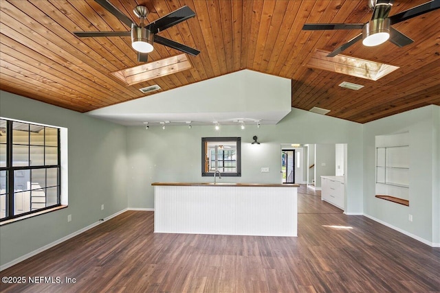 1344 Degrove Rd, Saint Johns, FL 32259 - unfurnished living room with a ceiling fan, a skylight, wood ceiling, vaulted ceiling, and dark wood-style floors