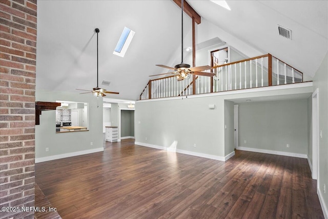 1344 Degrove Rd, Saint Johns, FL 32259 - unfurnished living room with high vaulted ceiling, a ceiling fan, a skylight, wood finished floors, and beam ceiling