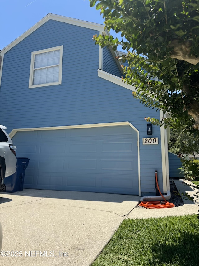 200 Spindrift Ln, Neptune Beach, FL 32266 - garage featuring driveway