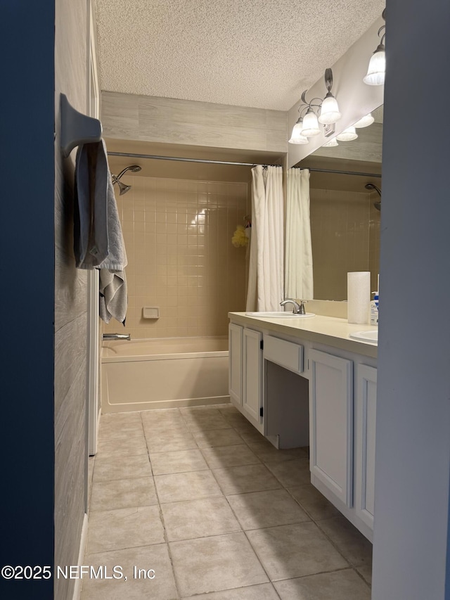 200 Spindrift Ln, Neptune Beach, FL 32266 - bathroom with a textured ceiling, tile patterned floors, double vanity, and shower / bath combo with shower curtain