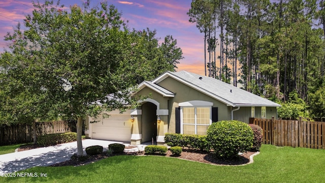 1804 Ferncreek Dr, Saint Augustine, FL 32092 - ranch-style home with driveway, an attached garage, and stucco siding