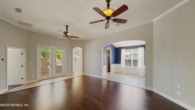 1804 Ferncreek Dr, Saint Augustine, FL 32092 - spare room with arched walkways, wood finished floors, ceiling fan, crown molding, and baseboards