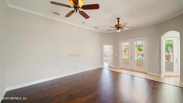 1804 Ferncreek Dr, Saint Augustine, FL 32092 - empty room featuring arched walkways, a ceiling fan, wood finished floors, baseboards, and ornamental molding