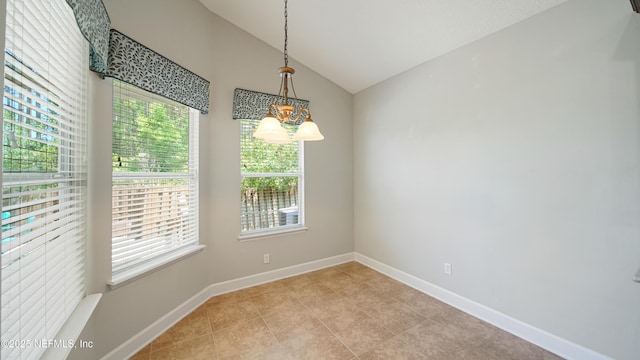 1804 Ferncreek Dr, Saint Augustine, FL 32092 - empty room featuring lofted ceiling, baseboards, and a chandelier