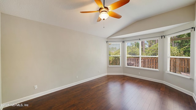 1804 Ferncreek Dr, Saint Augustine, FL 32092 - spare room with vaulted ceiling, baseboards, a ceiling fan, and dark wood-type flooring