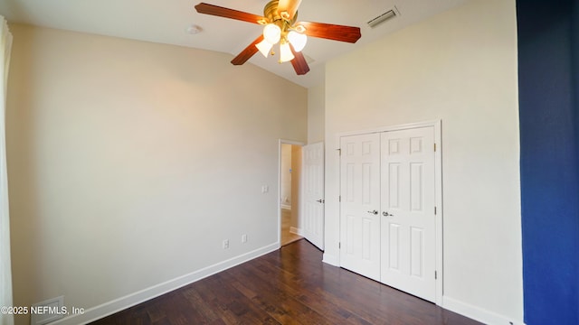1804 Ferncreek Dr, Saint Augustine, FL 32092 - unfurnished bedroom featuring baseboards, dark wood finished floors, a closet, high vaulted ceiling, and ceiling fan