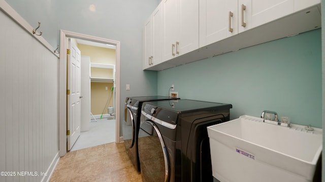 1804 Ferncreek Dr, Saint Augustine, FL 32092 - laundry area with cabinet space, washing machine and dryer, and light tile patterned floors