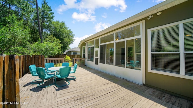 1804 Ferncreek Dr, Saint Augustine, FL 32092 - wooden deck featuring outdoor dining area and a sunroom