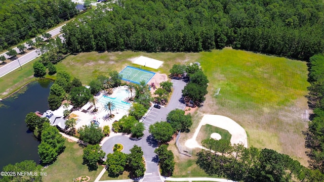 1804 Ferncreek Dr, Saint Augustine, FL 32092 - drone / aerial view of a pool area, a nearby body of water, and a heavily wooded area