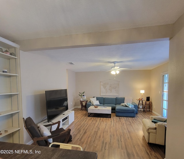5201 Atlantic Blvd Unit 68, Jacksonville, FL 32207 - living room featuring wood finished floors, ceiling fan, and baseboards