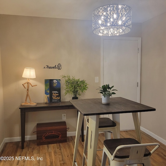 5201 Atlantic Blvd Unit 68, Jacksonville, FL 32207 - dining room with baseboards, wood finished floors, and a chandelier