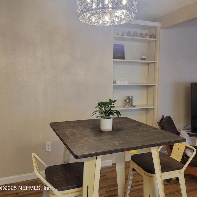 5201 Atlantic Blvd Unit 68, Jacksonville, FL 32207 - dining area with a chandelier, wood finished floors, and baseboards