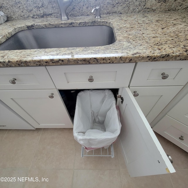 5201 Atlantic Blvd Unit 68, Jacksonville, FL 32207 - detailed view of a sink, white cabinetry, and light stone countertops