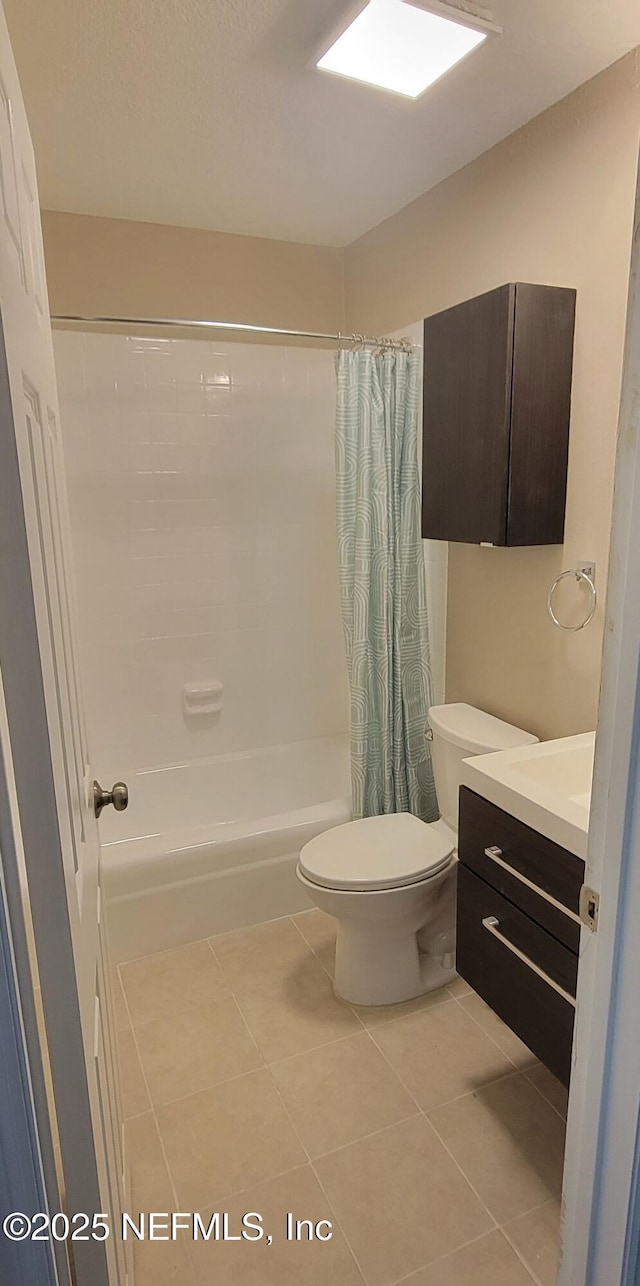 5201 Atlantic Blvd Unit 68, Jacksonville, FL 32207 - full bath with tile patterned floors, vanity, shower / tub combo with curtain, and toilet