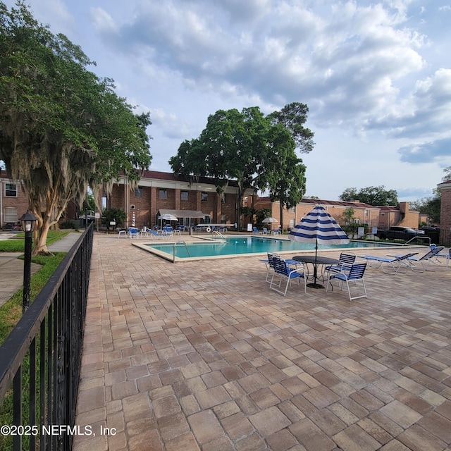 5201 Atlantic Blvd Unit 68, Jacksonville, FL 32207 - community pool featuring a patio